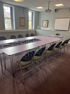 Room 1 set out for a formal meeting